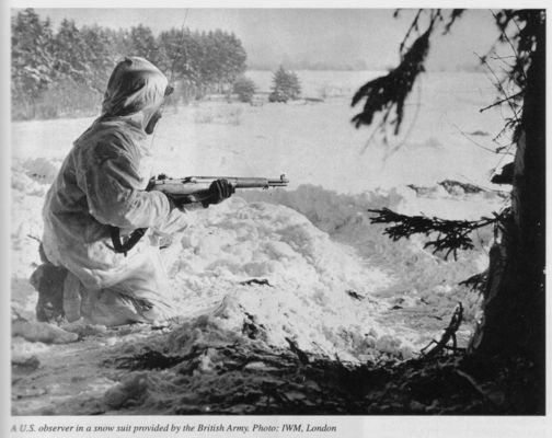 Click to view full size image
 ============== 
US Soldier with rifle
Photo says British issue snow suit

