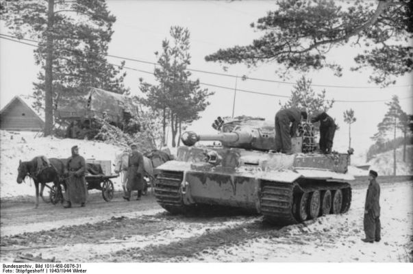 Click to view full size image
 ============== 
German donkey and horse carts passing by a Tiger I heavy tank in a Russian town, winter of 1943-1944.

Source: German Federal Archive
